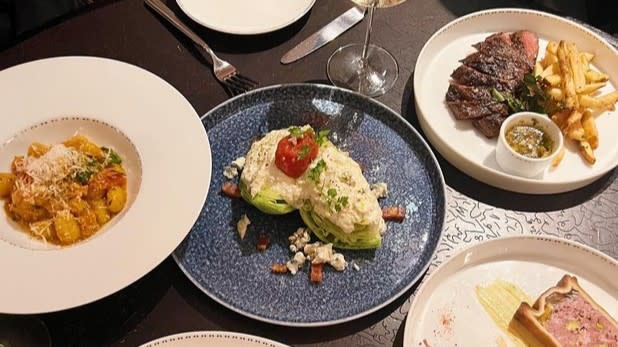 Various dishes of food on a table during New York City Restaurant week
