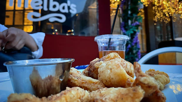 A plate of fried chicken on a table outside Melba's in Harlem