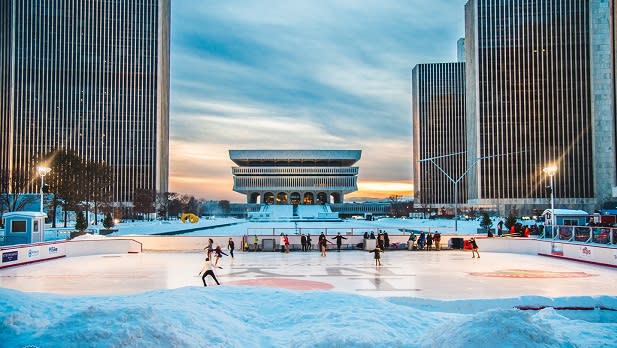 People skate on the ice at Empire State Plaza