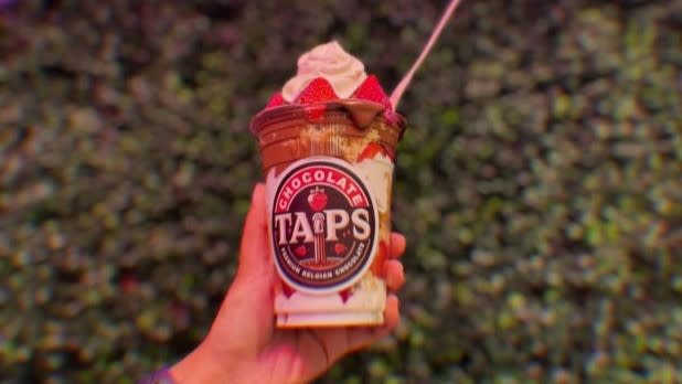 A cup of layered whipped cream, strawberries, and Belgian chocolate drizzle from Chocolate Taps at the New York State Fair.