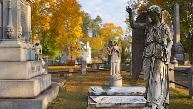 A statue and fall foliage in Sleepy Hollow Cemetery
