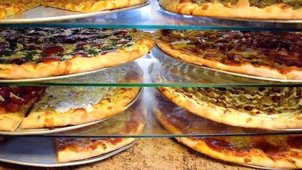 Several pies on display at Tino's Pizza in Oneonta