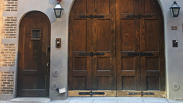 Close up of the wooden carriage doors to Taylor Swift's former townhouse at 23 Cornelia Street
