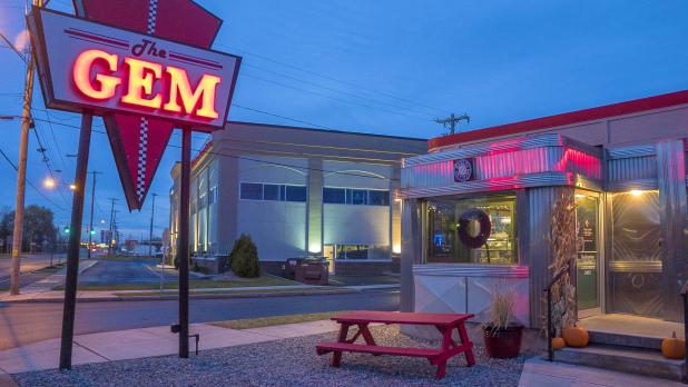 exterior of the retro-style Gem Diner in Syracuse, NY at night
