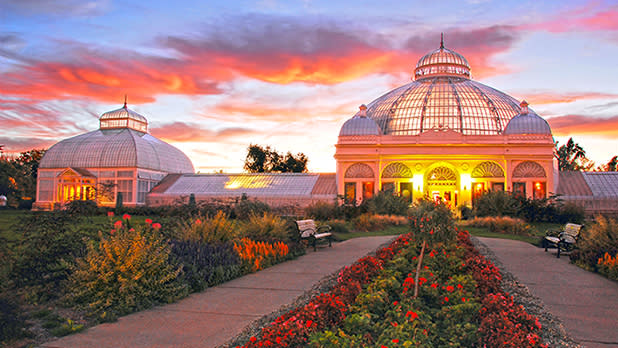 The building and gardens at Buffalo and Erie County Botanical Gardens at sunset
