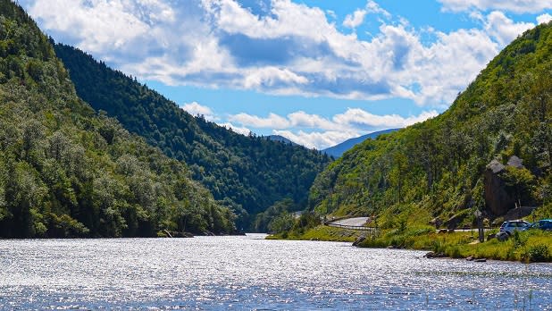 Sparkling Upper Cascade Lakes flowing through the green mountains of the Adirondacks on a sunny day