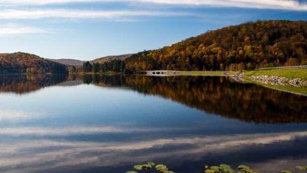 Fall foliage reflects in the lake at Allegany State Park