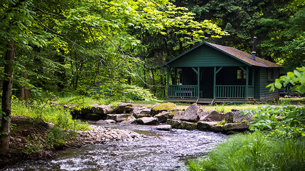 A cabin along a stream in Allegany State Park