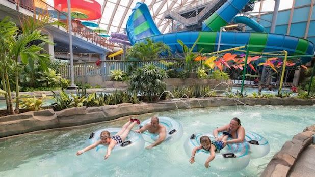a family of four floats down the lazy river at Kartrite Resort & Indoor Waterpark