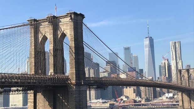 A view of the Brooklyn Bridge looking at Manhattan with the World Trade Center in the backdrop