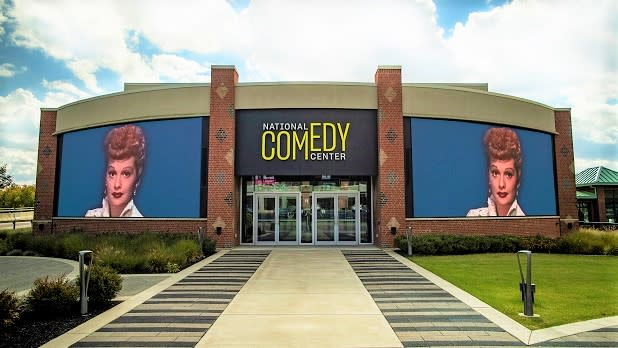 Images of Lucille Ball on two screens on the exterior of the National Comedy Center in Jamestown