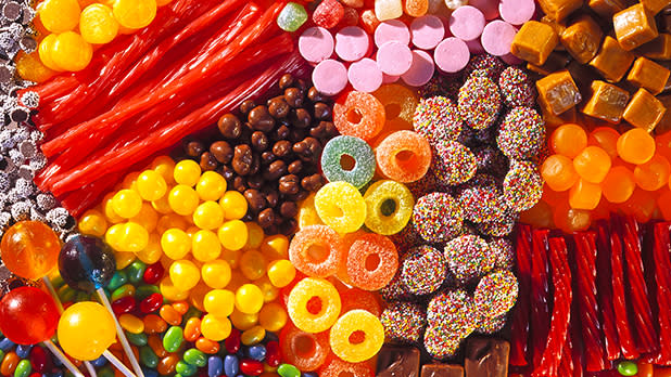 A spread of several bright multicolored candies and chocolates