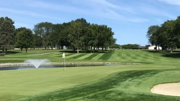 View looking out at a green golf course