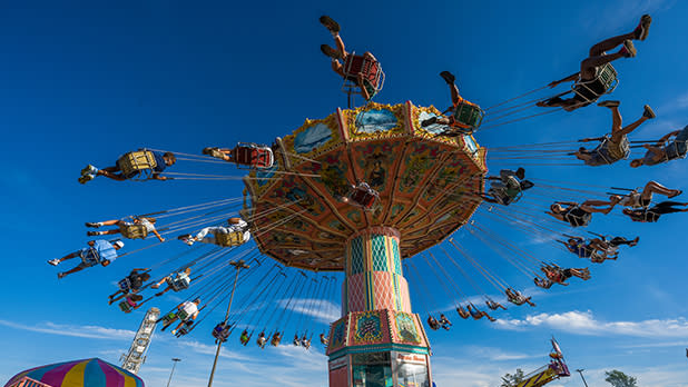 People riding the Swing Ride at a county fair.