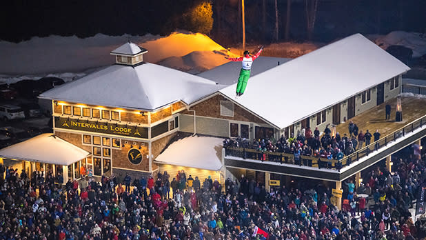 Crowds gather at night to watch athletes compete at the FIS Ski Jumping World Cup