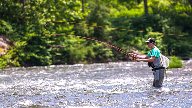 A man fly fishing on Esopus river