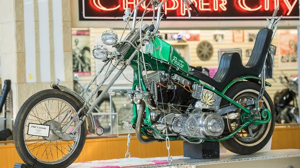 A green 1965 custom motorcycle on display at the Motorcyclepedia Museum in Newburgh