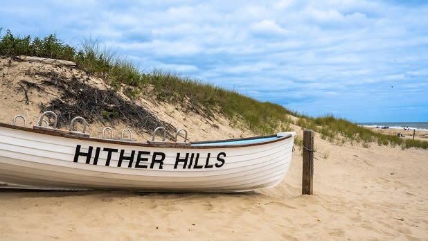 A white decorate skiff on the sand at Hither Hills State Park