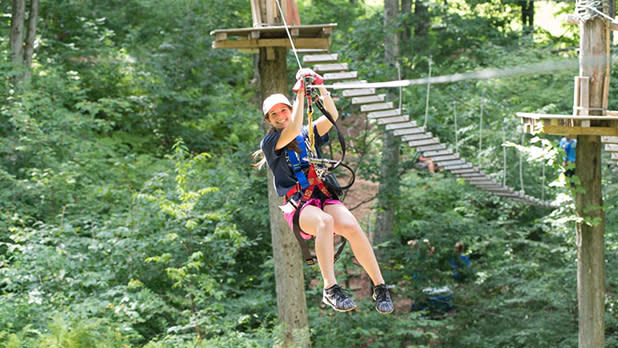 A woman on Zipline in the summer.