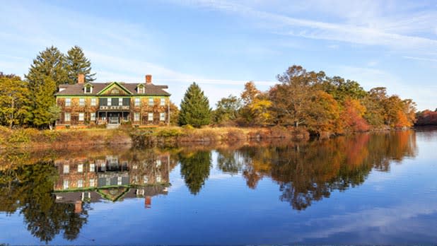 View of beautiful fall foliage and the former South Side Sportsmen’s Club at Connetquot River State Park