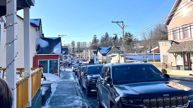 Snowy street view of colorful local shops in Tannersville, NY