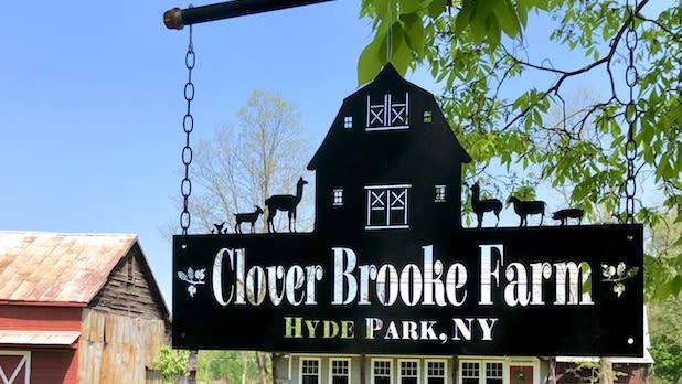 Photo of a sign that reads "Clover Brooke Farm, Hyde Park, NY"