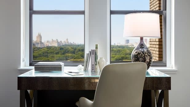 A desk at a window overlooking Central Park at JW Marriott Essex House