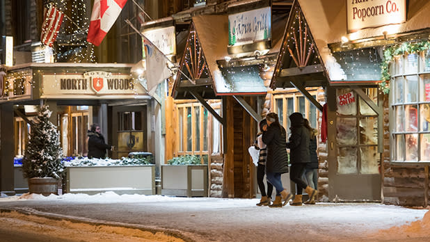 Group of people walking down Lake Placid's main street