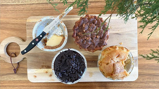 Four little pies on a cutting board