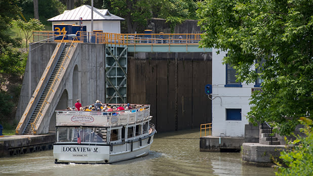 A boat approaches a lock on the Erie Canal
