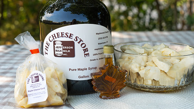 A display of maple cheese curds and New York Maple Syrup