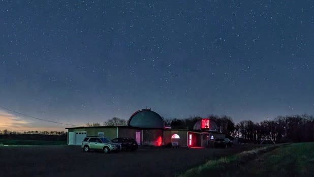 Exterior view of the Martz-Kohl Observatory with the night sky covered in stars