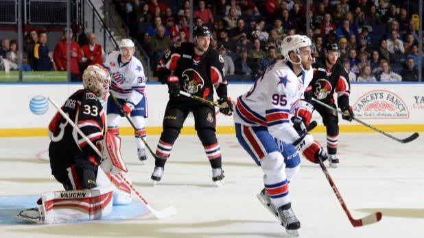 Hockey players skating during a game