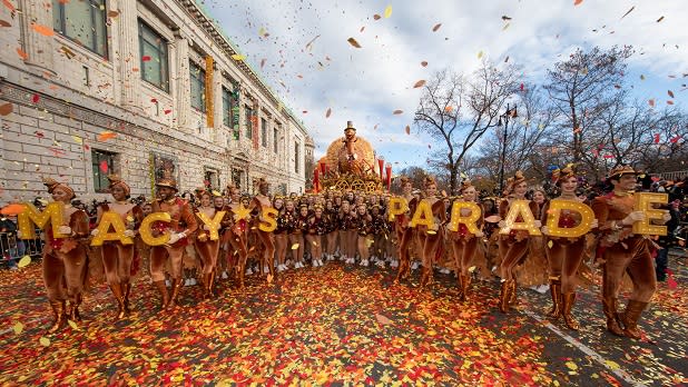 Confetti falls on Macy's Thanksgiving Day Parade participants and the famed Tom Turkey float