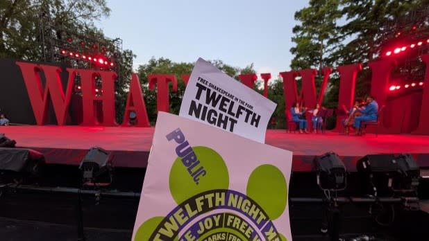 Delacorte Theater in Central Park, NYC, advertising the summer plays for Shakespeare in the Park.