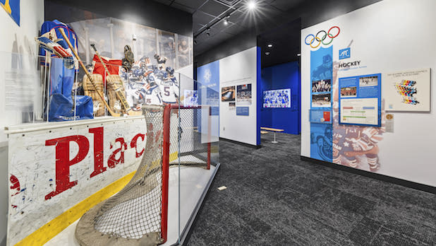 A hockey net and other gear featured in the Hockey Exhibit at the Olympic Center and Museum