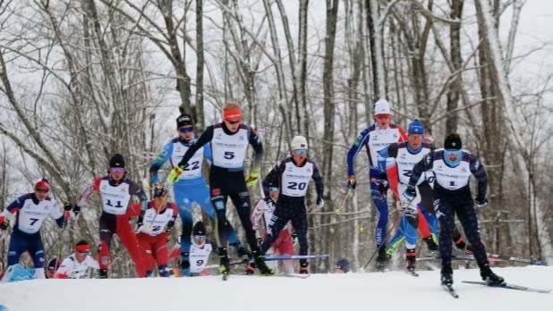 Cross-country skiers race to the finish line