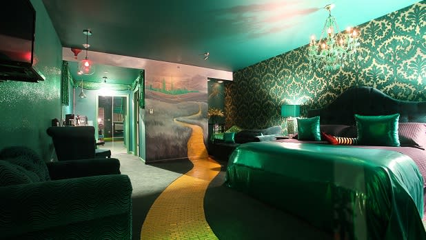 A Wizard of Oz-themed room complete with a yellow brick road and ruby slippers pillow at The Roxbury in the Catskills