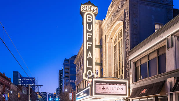 Night time exterior of the bright illuminated sign spelling out "Shea's Buffalo" at Shea's Buffalo