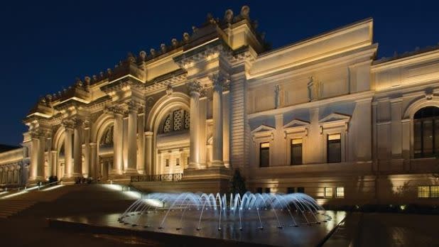 The Metropolitan Museum of Art at night with fountain