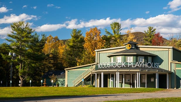 The Woodstock Playhouse, home to the Woodstock Film Festival, with fall-colored trees in the background