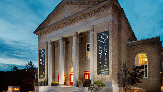 Beige building with four pillars at night