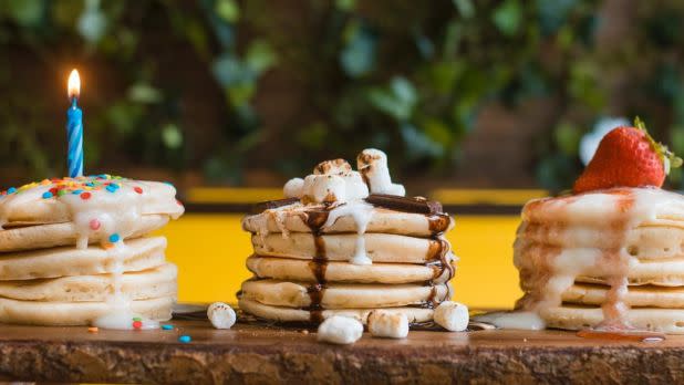 3 unique stacks of pancakes with toppings