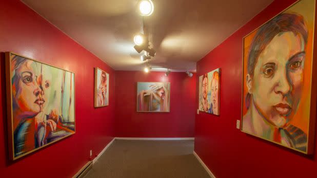 Interior of arts center, paintings on red walls