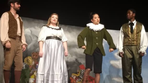 Actors in costume on stage