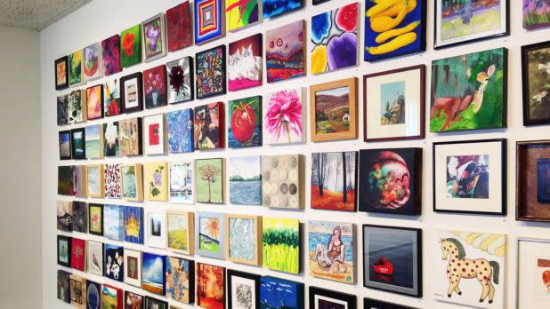 Interior wall of gallery, lined with pictures