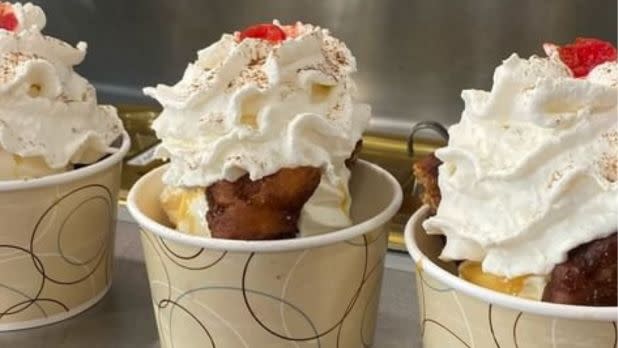 3 dishes of ice cream sundaes topped with whipped cream and cherry