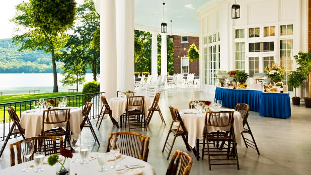Dining on a porch on Lake Otsega at The Otesaga Resort in Cooperstown New York