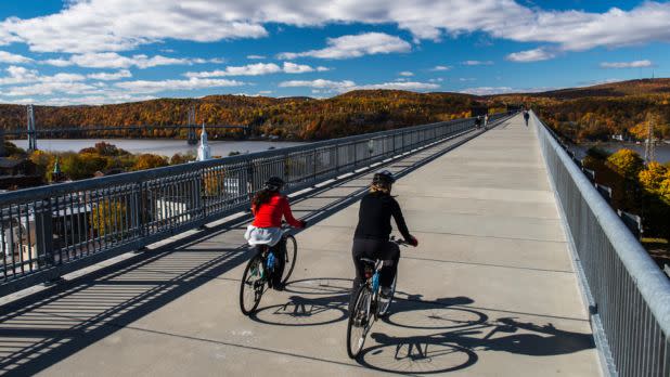 Bicyclists cycling on the walkway