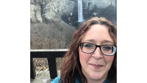 A selfie of Katharine with Taughannock Falls in the background